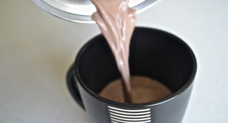 Pouring Colombian Hot Chocolate into a mug