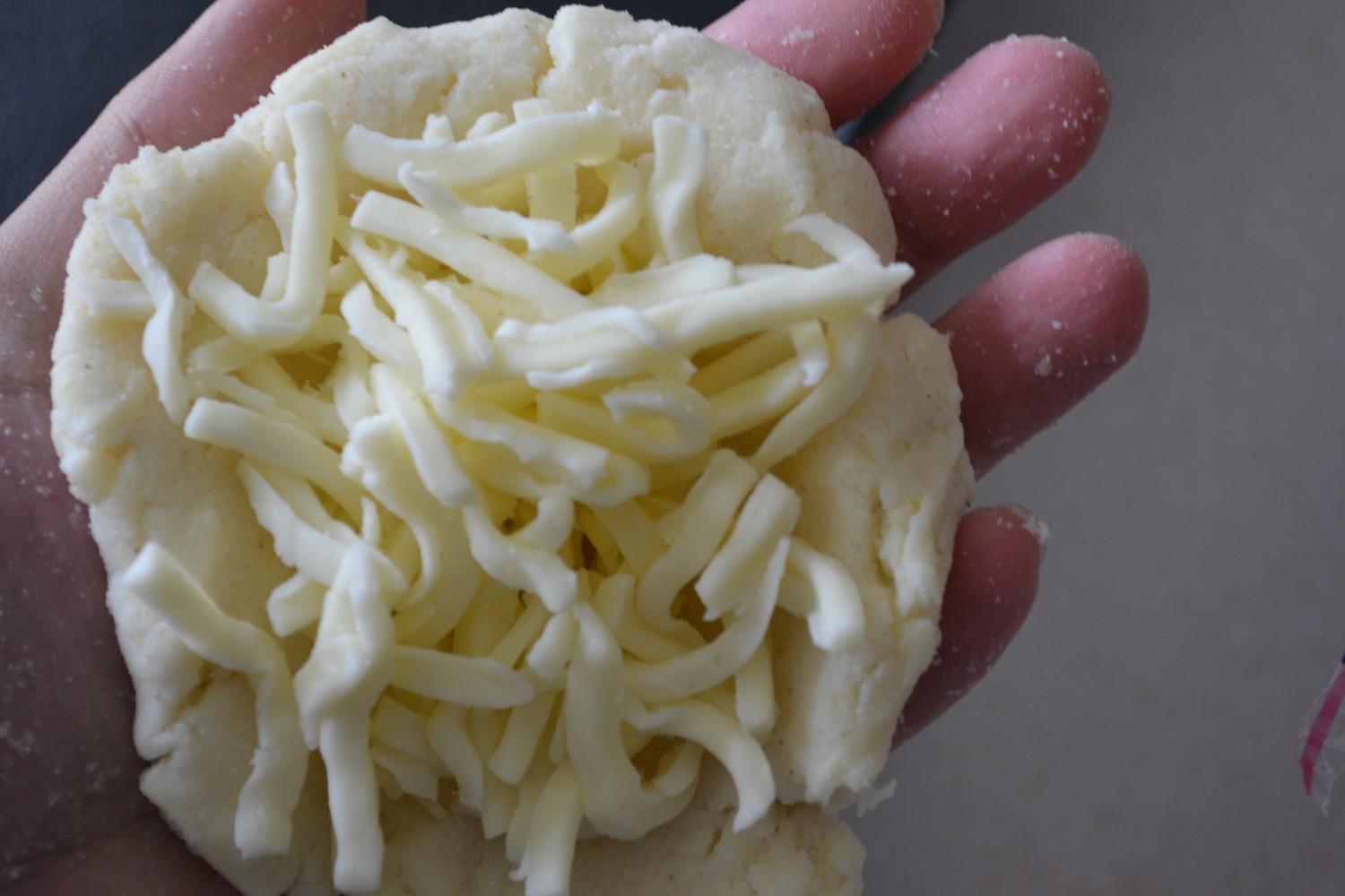 Forming the Arepa with Cheese.